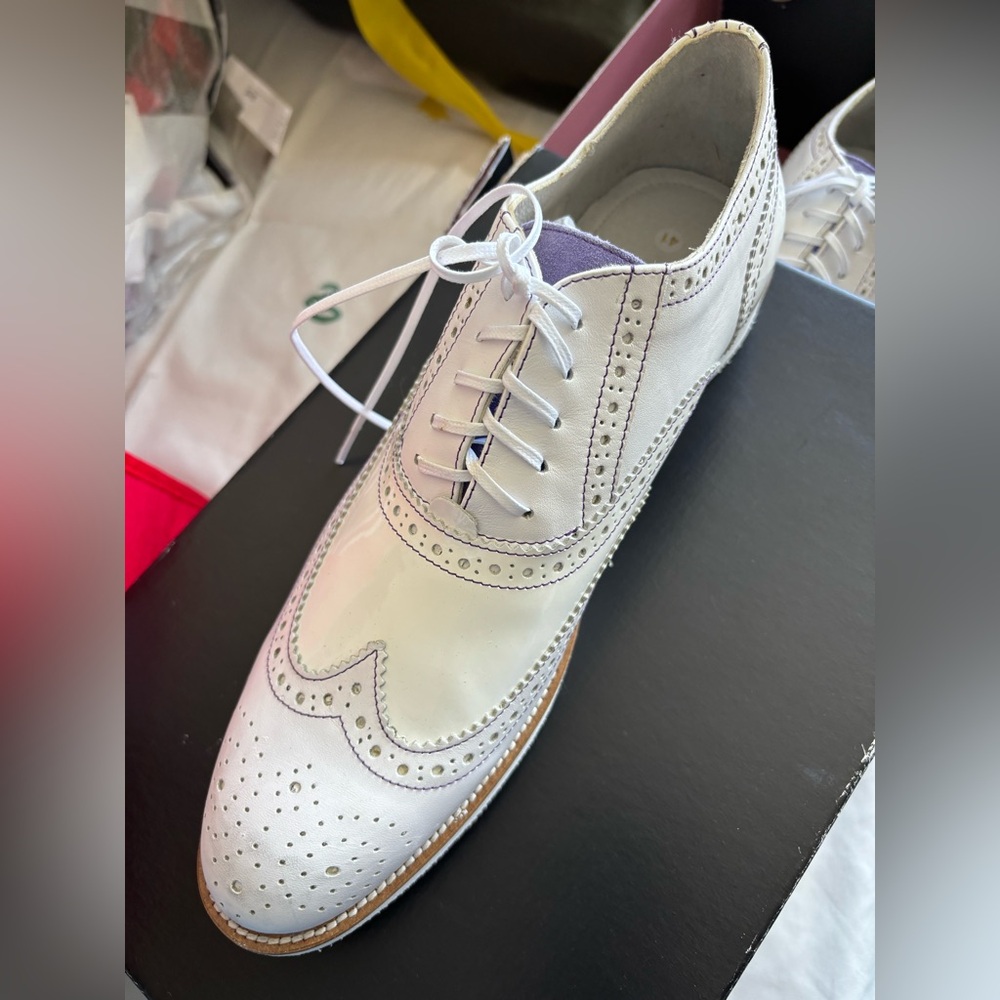 Brand new white custom shoes, purple stitching throughout shoe.